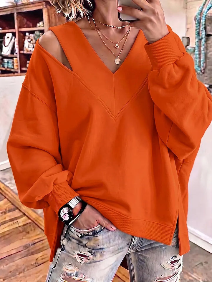 Kirstan - シックなカットアウトVネック オーバーサイズスウェットシャツ