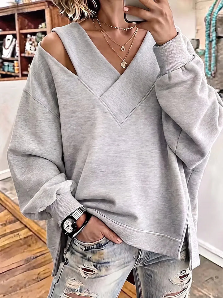 Kirstan - シックなカットアウトVネック オーバーサイズスウェットシャツ