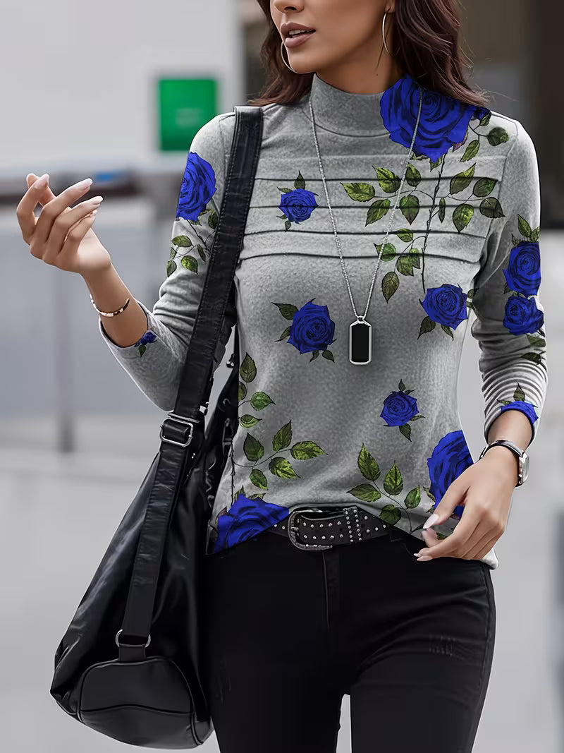 Zinie - フローラルプリントのモックネックトップス
