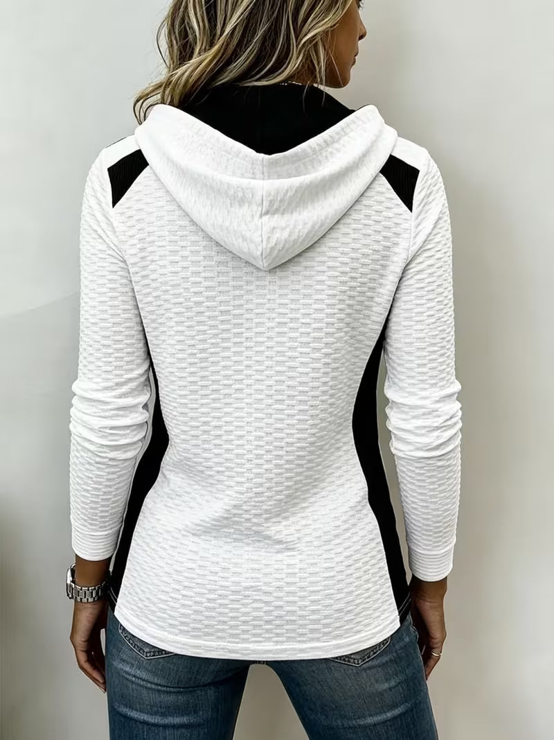 Leinea - テクスチャー加工のカラーブロック・フード付きトップス