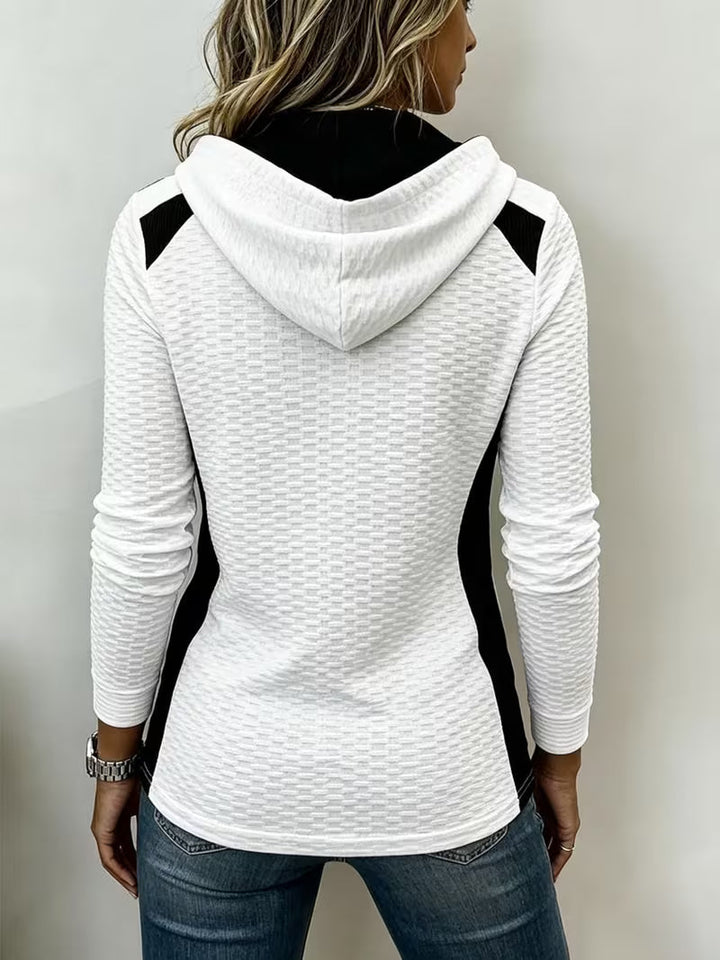 Leinea - テクスチャー加工のカラーブロック・フード付きトップス